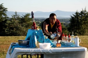 Ven. Acarya Namdrol Gyatso gathers the sang ingredients to offer into the fire.
