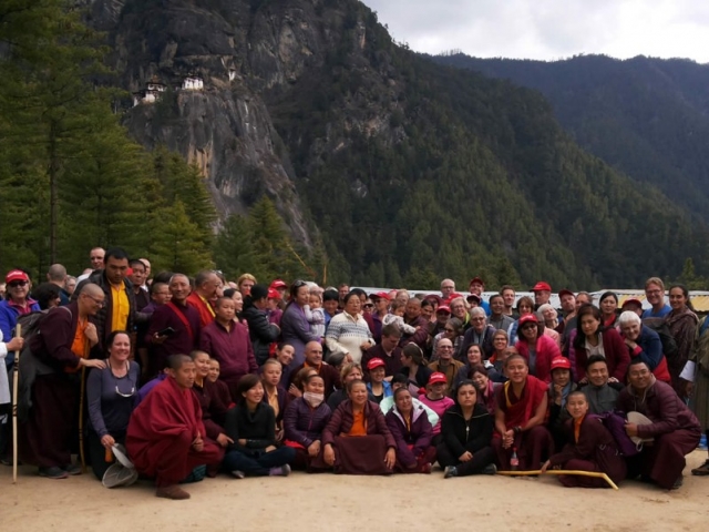 Group Photo at Taktsang The Mindrolling family, the monks and nuns of Mindrolling along with sangha members pose at the foot of Taktsang after their descent from the sacred site. Bhutan, April 2016.
