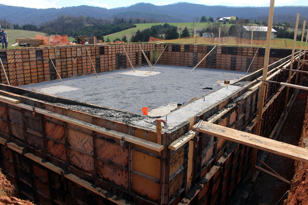MARCH 23-Section of wall-forms showing poured concrete. Workers used planks to mount the wall to smooth the new concrete.