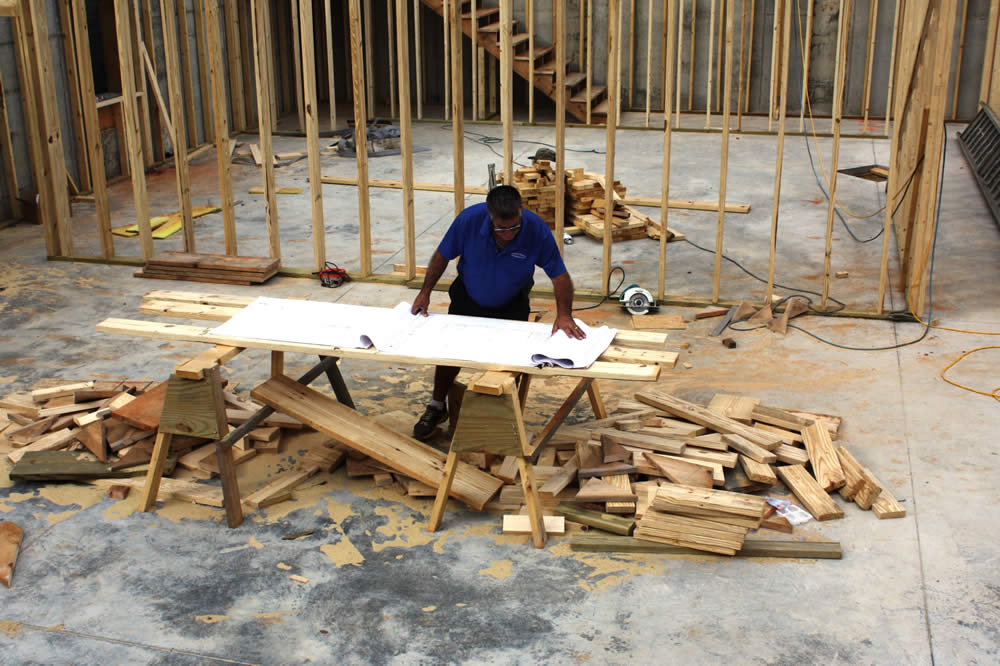 Builder, Mark Good, reviews the architectural drawings.