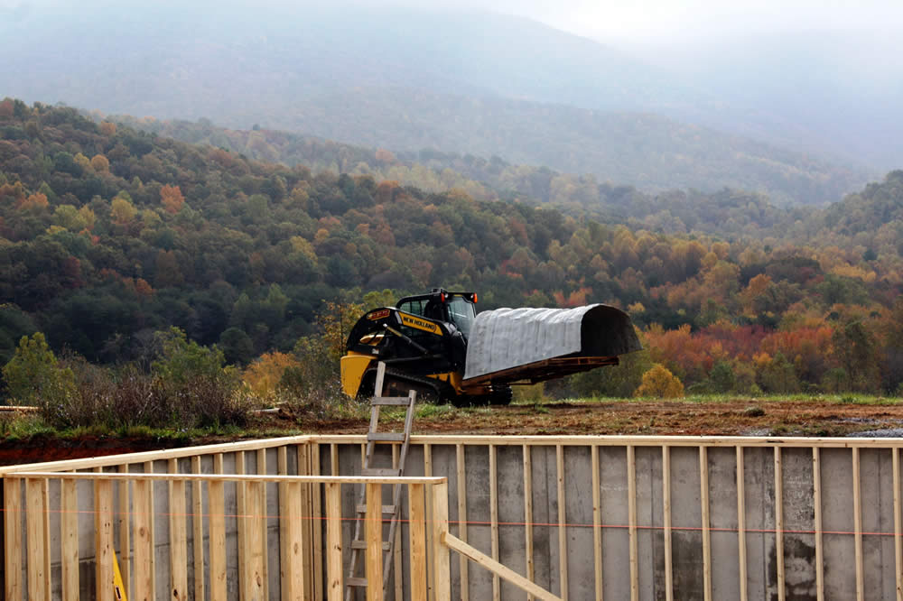 Moving a window well into position.