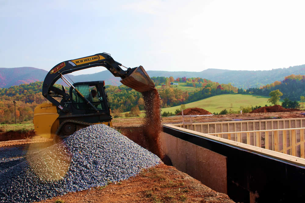 Filling the drainage trench surrounding the temple.
