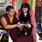 Tibetan Language Class Ven. Acarya Namdrol Gyatso works with a student during Tibetan language class